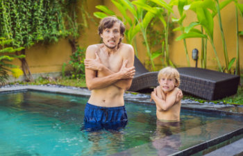 dad and son was frozen in the pool very cold water in the pool need heated water