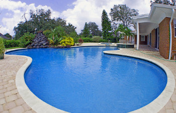 large elegant pool in front of the house